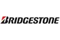 Bridgestone-Logo mit fettgedrucktem schwarzem Text und einem roten Akzent auf dem Buchstaben B auf weißem Hintergrund.