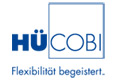 HÜCOBI-Logo mit dem Slogan Flexibilität begeistert. in blauer Schrift auf weißem Hintergrund.