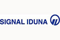 Signal Iduna-Logo in blauer Schrift mit einem kreisförmigen Symbol mit stilisierten Initialen auf weißem Hintergrund.